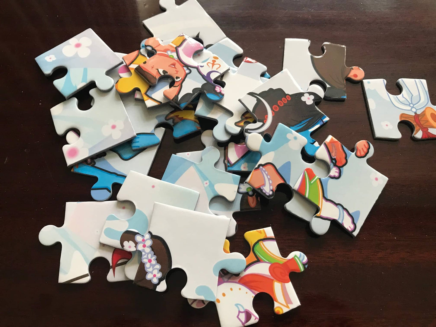 Colorful puzzle pieces on a dark surface