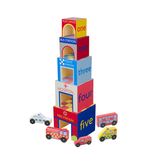 Stack of colourful wooden toy blocks with different UK emergency service names and small toy vehicles on a white background
