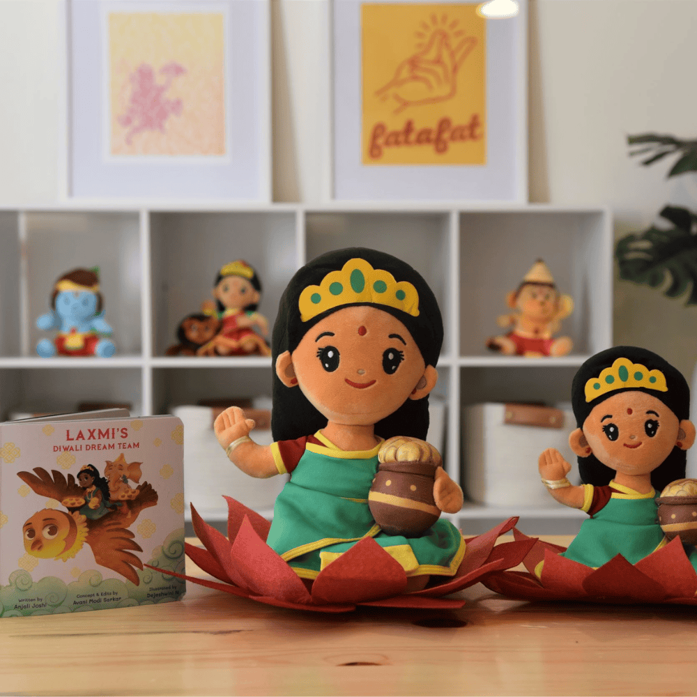 A bundle of Laxmi plush toys in two sizes by Modi Toys of Lakshmi Mata along with a story book about the Hindu Goddess