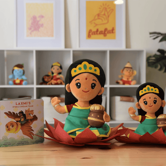 A bundle of Laxmi plush toys in two sizes by Modi Toys of Lakshmi Mata along with a story book about the Hindu Goddess