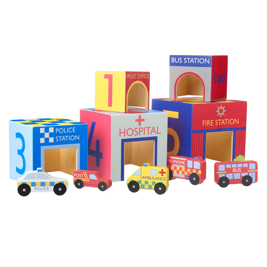 Colourful toy blocks resembling different UK emergency service buildings and vehicles on a white background