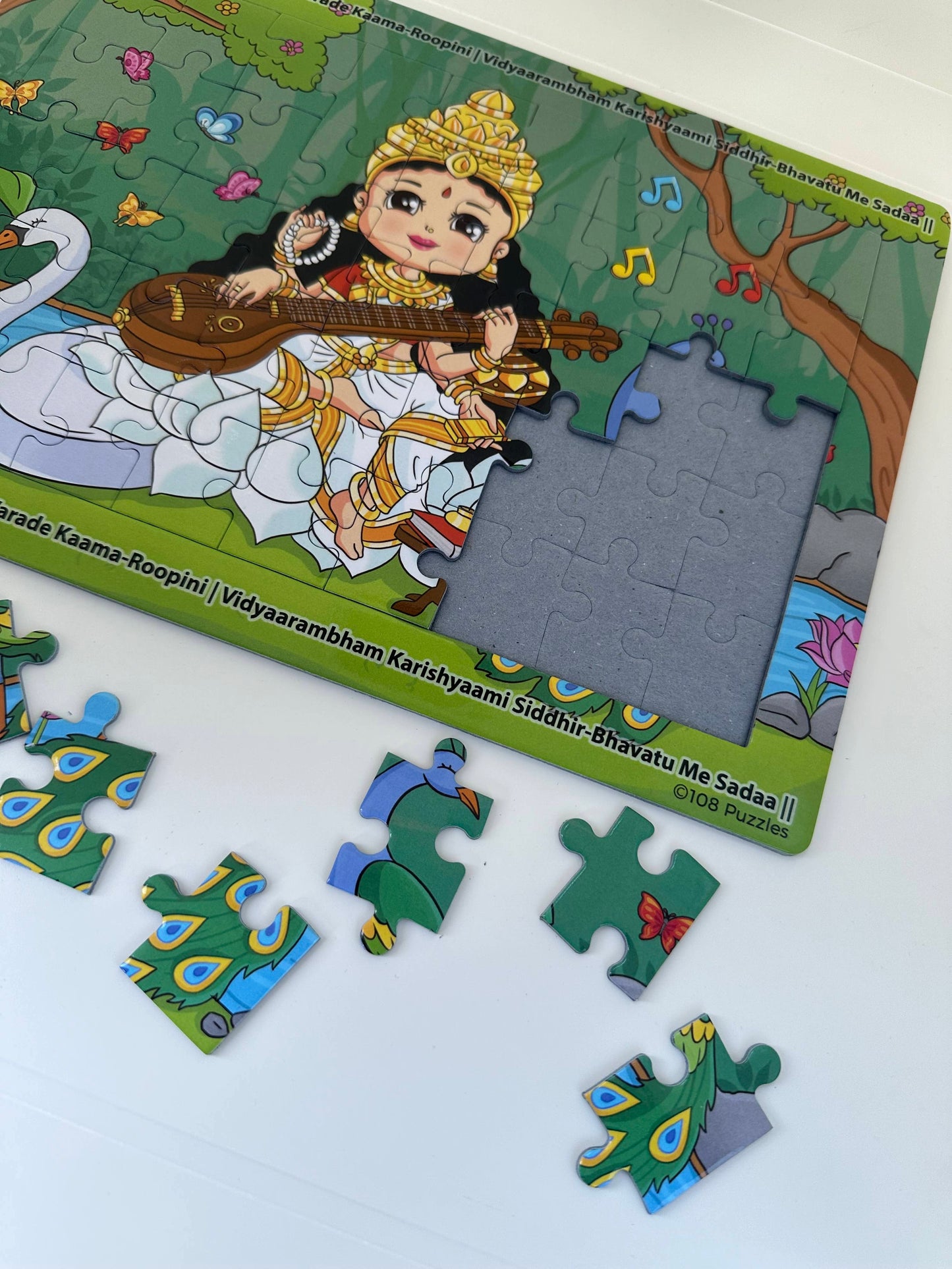 Children's puzzle with Goddess Saraswati holding the veena 