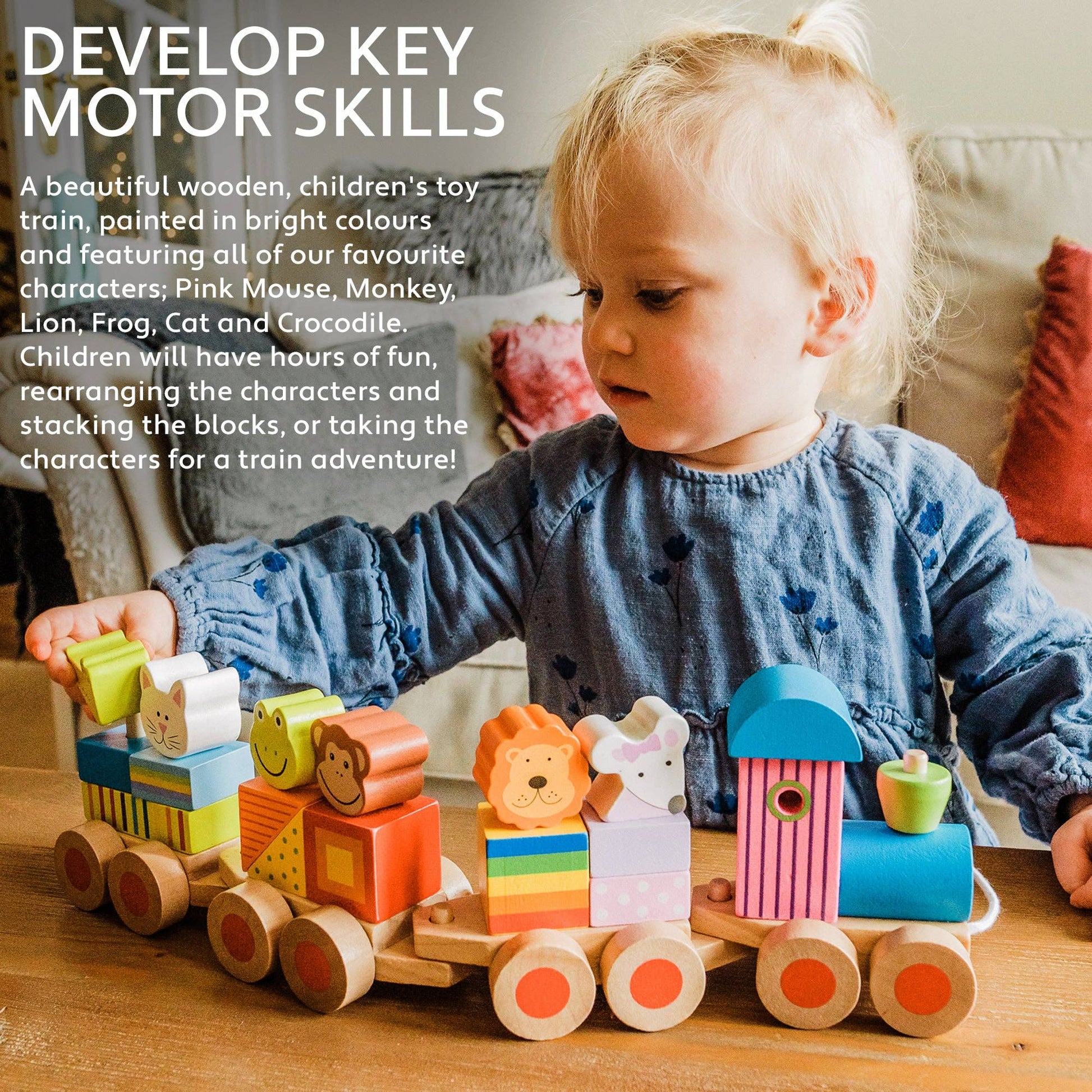 Child playing with a wooden toy train featuring colorful animal figures on a wooden table.