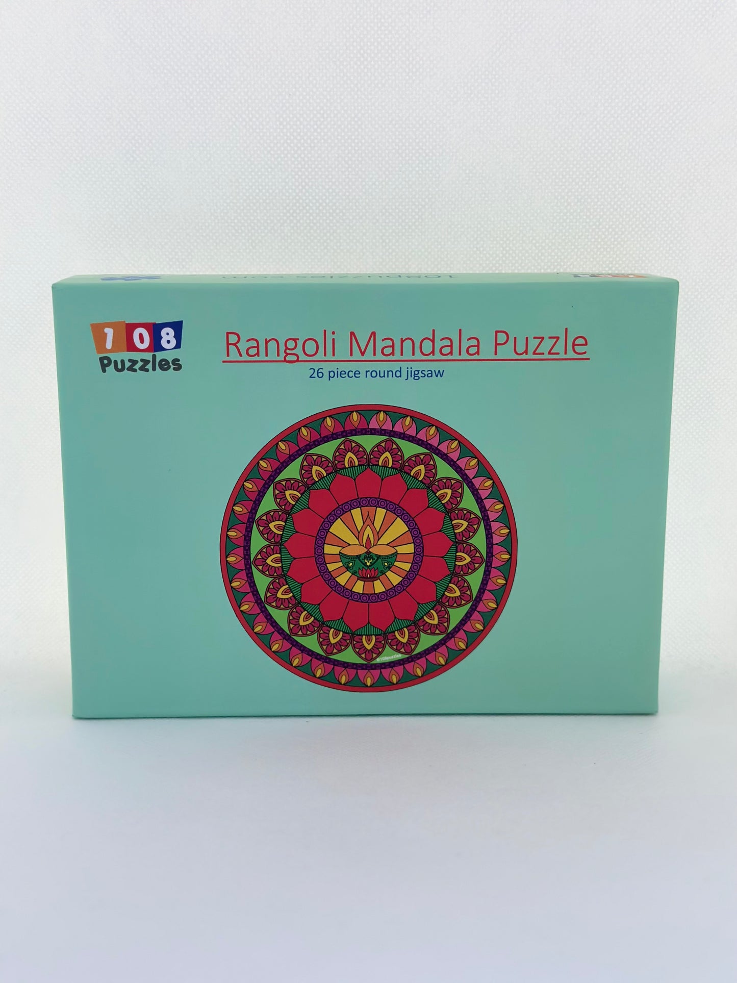 Box of Rangoli Mandala Puzzle with colourful design on a light green background