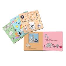 Set of three colourful children's books with characters on a white background with one book with the page open