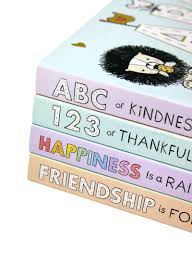 Stack of colorful books with motivational text on a white background